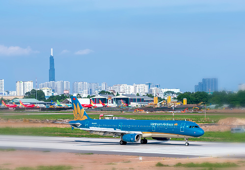 Ho Chi Minh City, Vietnam - May 20th, 2021: Cargo plane Airbus A321 of Vietnam Airlines landing at Tan Son Nhat International Airport, Ho Chi Minh City, Vietnam