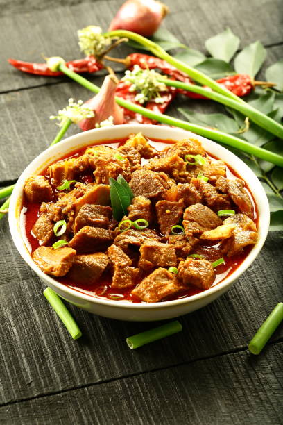 istock Indian meat curry served in ceramic bowl. 1322959556