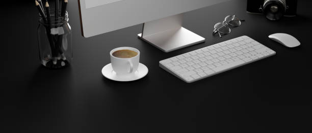 istock Dark computer desk with coffee cup, stationery, camera, glasses and copy space, 3D rendering 1322962045