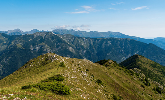 Retezat mountain range from Coada Oslei hill summit in Valcan mountains in Romania