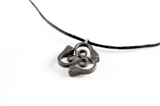 istock Triskel silver pendant necklace isolated on white background 1322966233