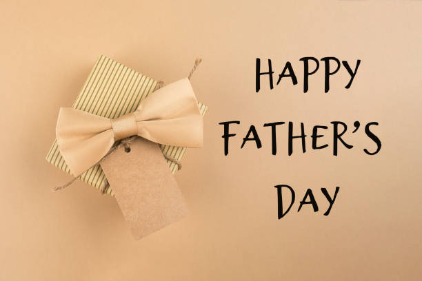 istock Greeting card for Happy Father's day. Gift box with on neutral background. Top view, flat lay 1322966432