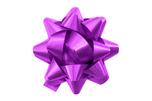 istock Shining anniversary gift and present decorating silky ornament concept purple sleek polished glossy bow isolated on white background clipping path cutout 1322970192