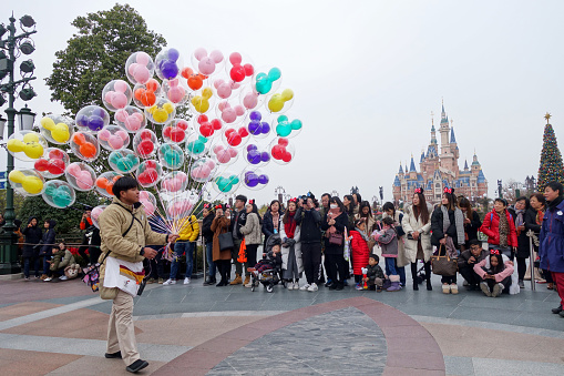 Shanghai, China- Dec 26, 2017: Tourists enjoy activities inside the Shanghai Disneyland , China. It is the first Disney park resort in mainland China