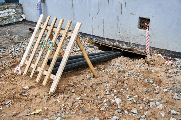 istock New water pipes digging under apartment building at repair 1322974764