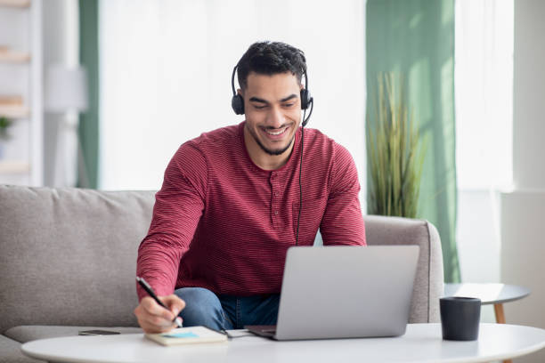 istock Happy arab guy attending online training from home 1322975365
