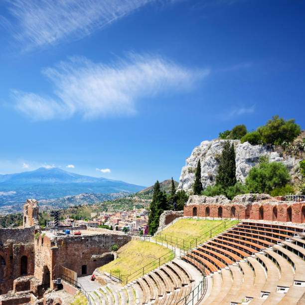 The Greco-Roman amphitheatre at Taormina with Mt.Etna in background, Sicily, Italy