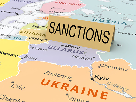 Sanctions paper card on map of Belarus. As background used CIA Map that are in the public domain https://www.cia.gov/the-world-factbook/maps/world-regional/