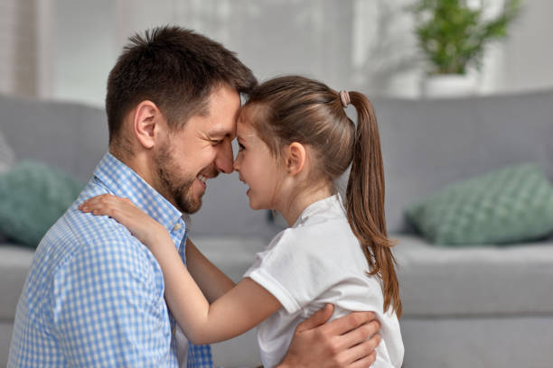 istock cute child daughter and father hug. father's day 1322978005