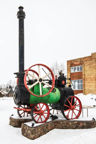 A rusty exhaust pipe on a tractor's hood signifies aging machinery and the relentless work of farming