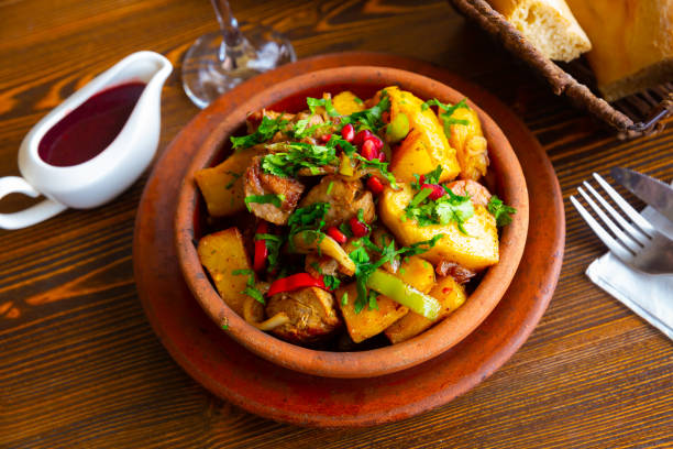 istock Traditional georgian Ojakhuri with pomegranate in earthenware ketsi pan 1322979732