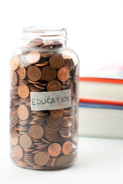 istock Savings for education in jar 1322981225