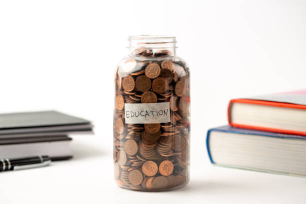 istock Savings for education in jar 1322981239