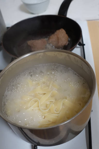 istock Tagliatelle pasta and rump steak being cooked 1322981257