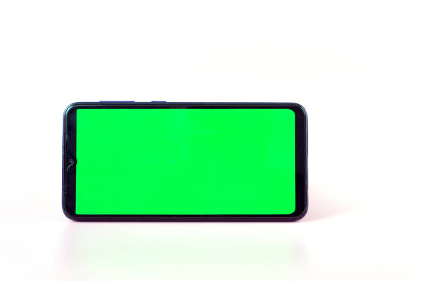 istock Smartphone in a horizontal position with a green screen on a white background. Chroma key. Mock up 1322982121