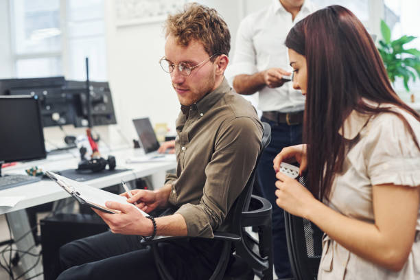 istock Young business people working together in the modern office 1322982235