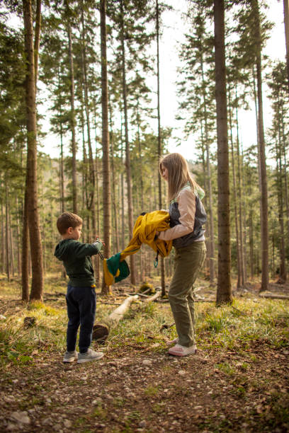 istock Preparing a hammock for resting in nature 1322982295