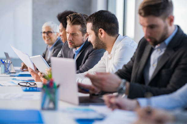 istock Businessmen working on touchpad and reports in the office. 1322983254