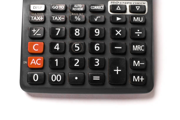 Black calculator on white background isolated stock image.