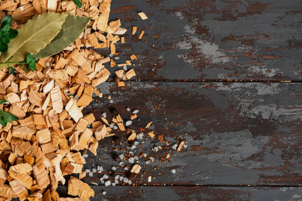 istock Frame from wood chips for smoking on a dark wood background 1322984392