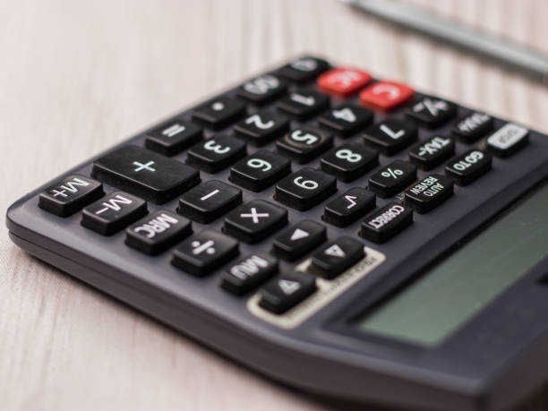 istock Black calculator on texture background stock image. 1322985627