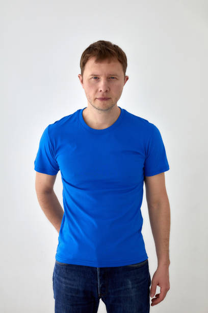 istock Young man in casual outfit standing on white background 1322986900