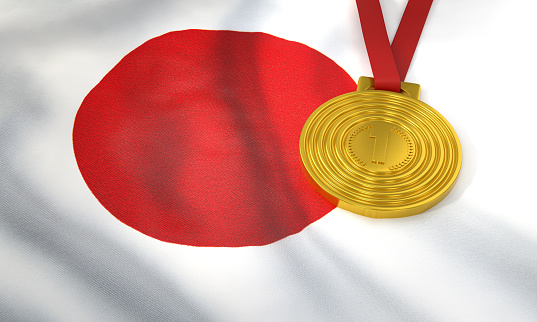 Japanese flag and gold medal. International games and winning concept.