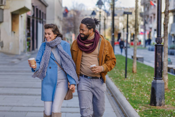 istock Cheerful Multi-Ethnic Couple is Sharing the Love in Public Park. 1322987956