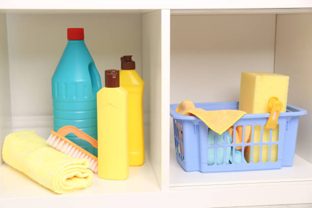 istock Different cleaning supplies and tools on shelves 1322989243