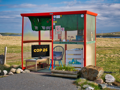 Decorated in support COP26 in November 2021, Bobby's Bus Shelter - also known as the Unst Bus Shelter - near Baltasound on the island of Unst in Shetland, Scotland, UK.