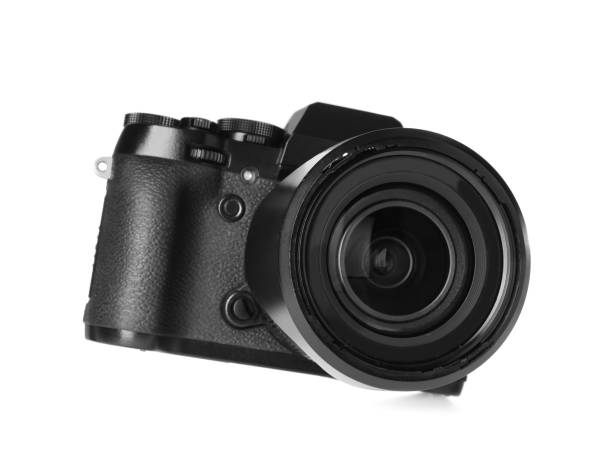 istock Modern digital camera isolated on white. Photography equipment 1322989446