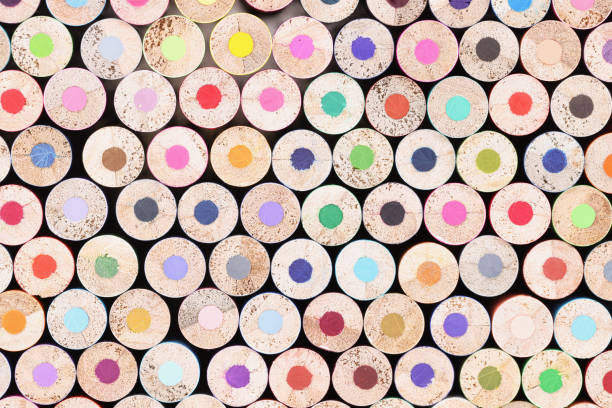 istock Closeup of many unsharpened multicolored wooden pencils background 1322990304