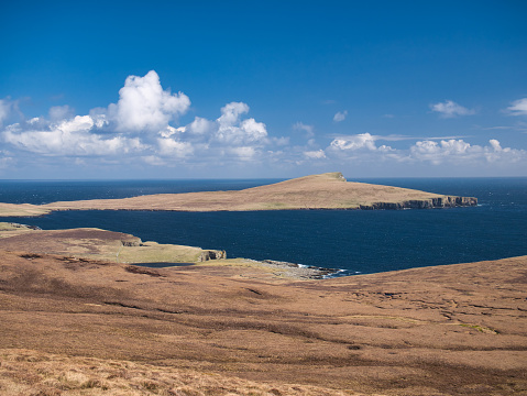 Home to a National Nature Reserve, the island of Noss from the hill of the Ward of Bressay on the island of Bressay, Shetland, UK. Taken on a sunny day in spring.