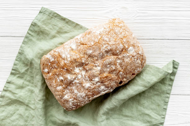 istock Bakery food background. Loaf of bread top view 1322990747