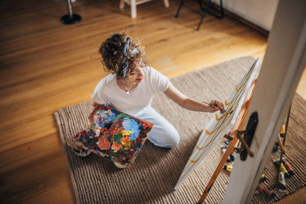 istock Young female painter painting 1322990805
