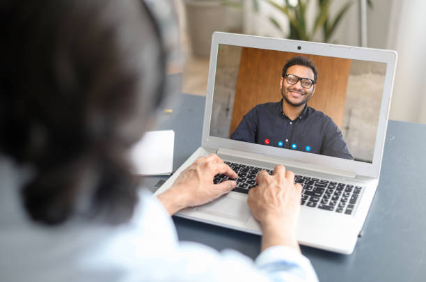 istock Two indian colleagues or friends speaking through the screen 1322991705