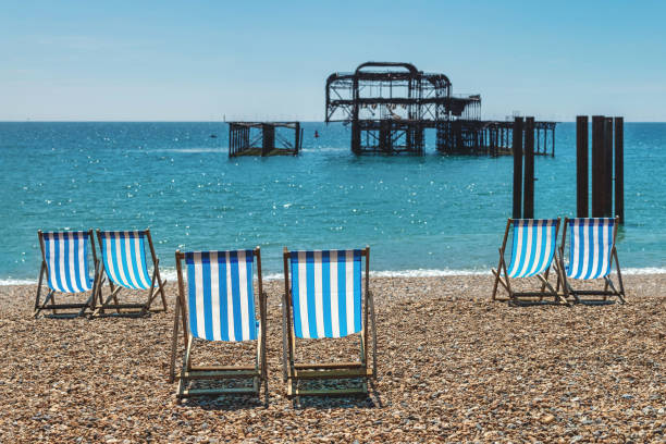 Beach Chairs on the shore at Brighton England. Brightly colored beach chairs on the shore at Brighton Beach in England
