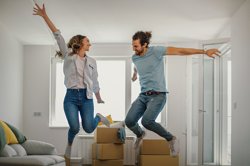 Couple excited for moving into a new apartment.