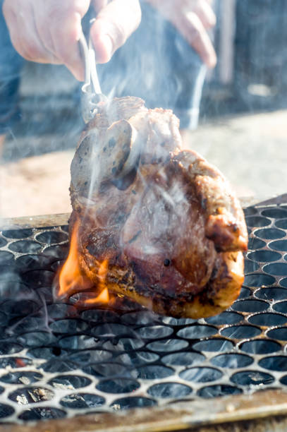 istock pork on the grill with smoke and fire 1322997540