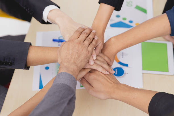 istock Closeup topview businesspeople join hand together.Stack of people hands. Unity and Team Teamwork Empower business worker for company concept. 1322997559