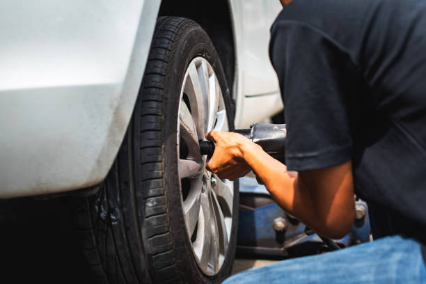 istock The technician doing assembling car wheel after finish repaired tire 1323001619