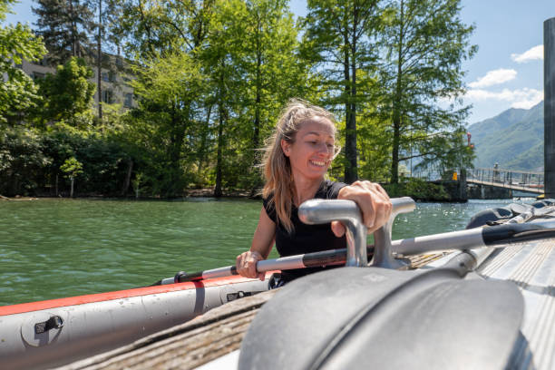 istock Young woman in red canoe getting on pier 1323001652