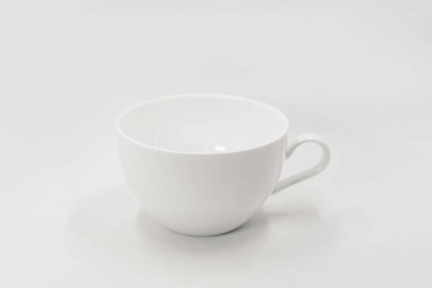 istock Close-up of coffee cup against white background 1323002135