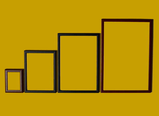 istock Empty picture frames on different colored background, on the wall, on the shelf, abstract, wooden frames. 1323003388