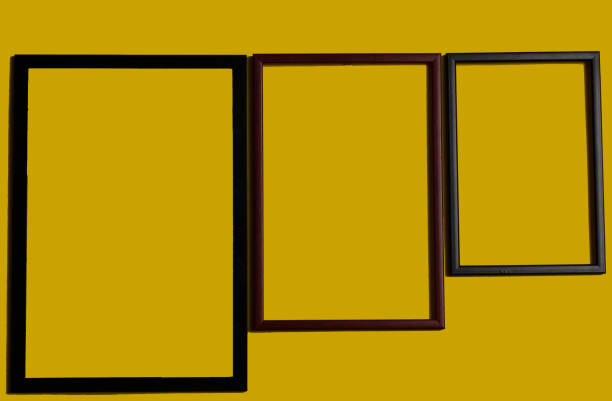 istock Empty picture frames on different colored background, on the wall, on the shelf, abstract, wooden frames. 1323003389