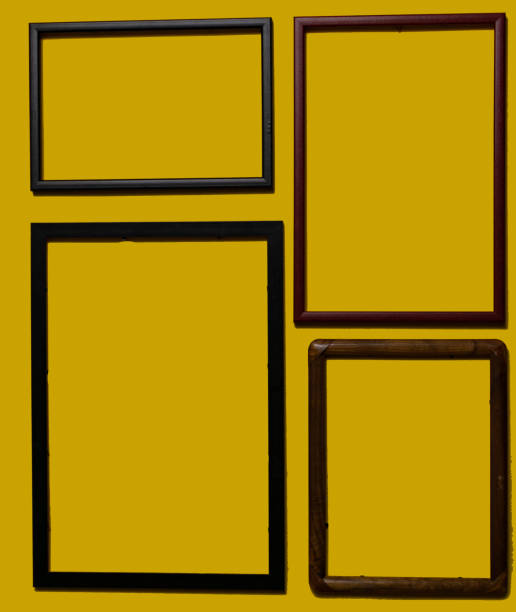 istock Empty picture frames on different colored background, on the wall, on the shelf, abstract, wooden frames. 1323003398