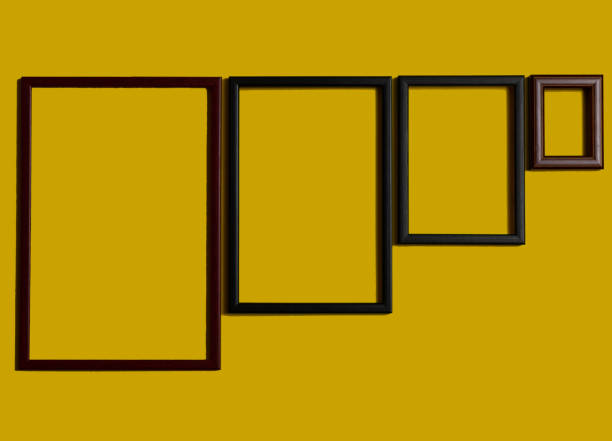istock Empty picture frames on different colored background, on the wall, on the shelf, abstract, wooden frames. 1323003404