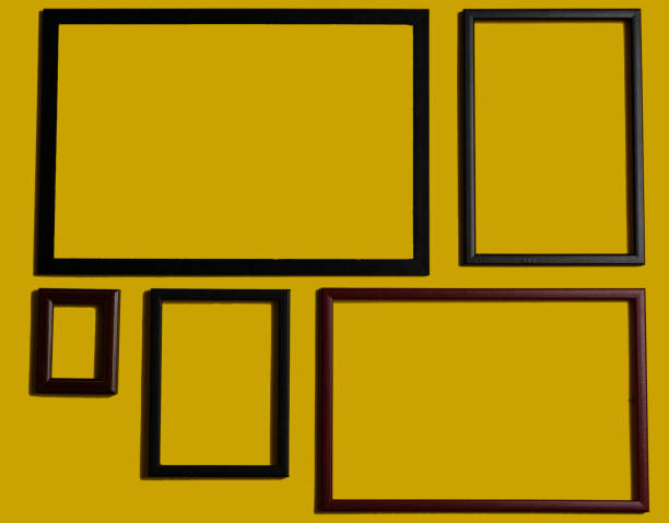 istock Empty picture frames on different colored background, on the wall, on the shelf, abstract, wooden frames. 1323003406