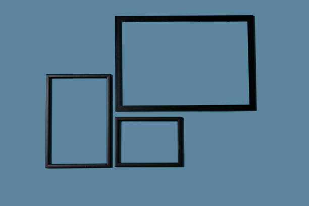 istock Empty picture frames on different colored background, on the wall, on the shelf, abstract, wooden frames. 1323003447