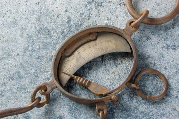 Antique brass iron rusty hand scales with hooks  on concrete background. Copy space for text.